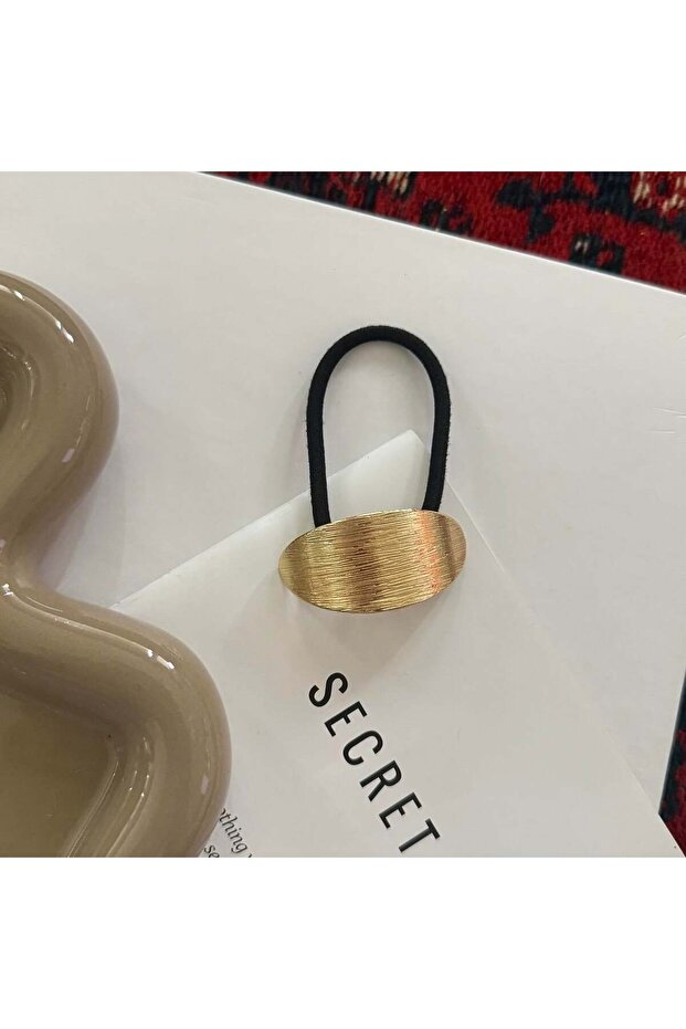 مشبك مطاطي بيضاوي ذهبي ذو ملمس بارز