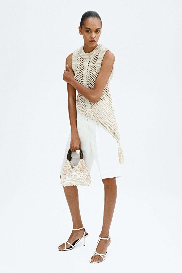 Crochet-look tassel-detail top