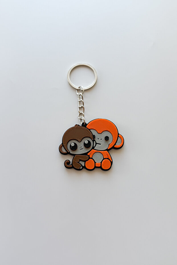 سلسلة مفاتيح فضية من Punch Monkey