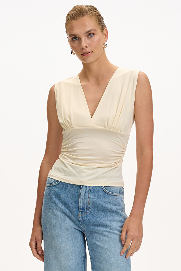 V-Neck Sleeveless Slim Fit Knitted Ecru Blouse with Gathered Sides
