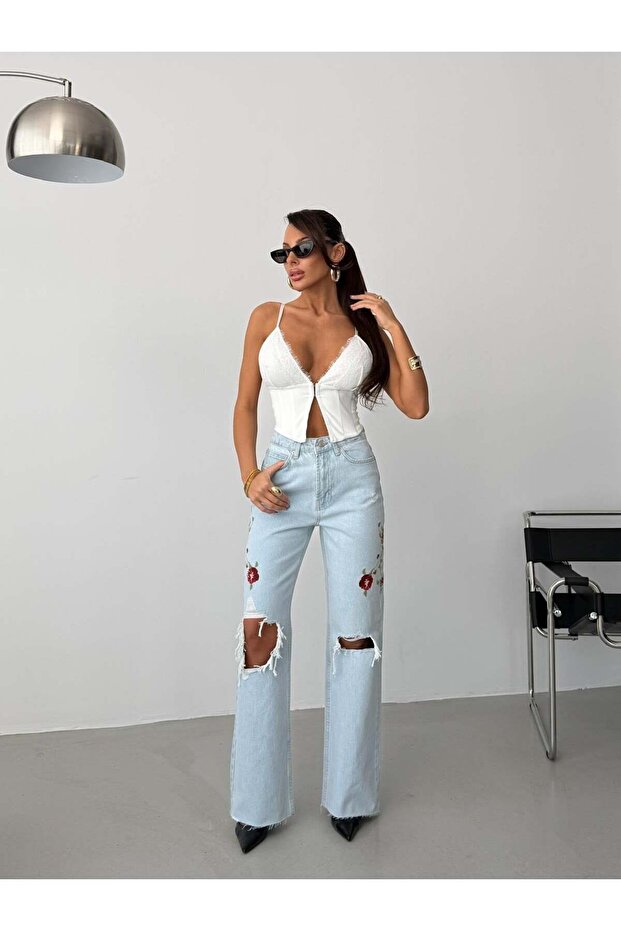 Embroidered detail, ripped hem, wide leg, high-waisted jeans
