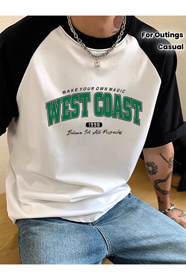 تي شيرت واسع الحجم بأكمام راجلان مطبوع عليه West Coast
