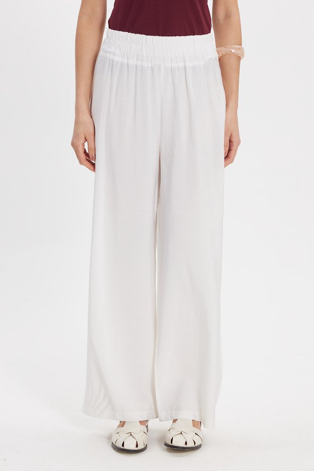 Women's relaxed fit white trousers with elastic waistband