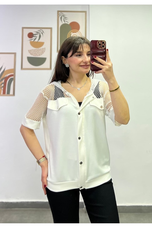 Blouse with Mesh Detailing on the Shoulders, Sleeves, and Hood, and Zipper Detailing on the Front.