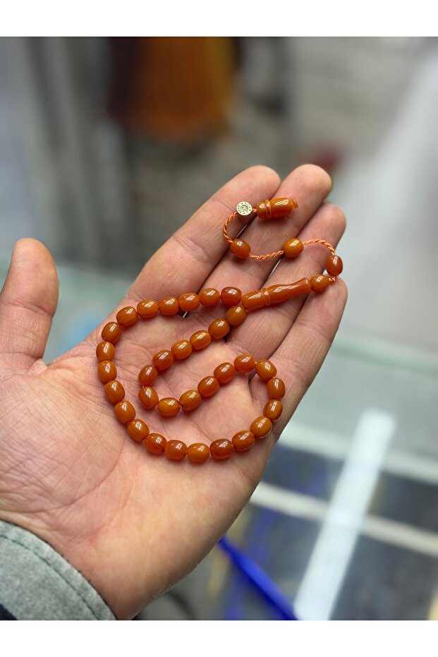 سوار عنبر قابل للطي بطول الكاحل موقع من قبل المعلم، قطعة تذكارية