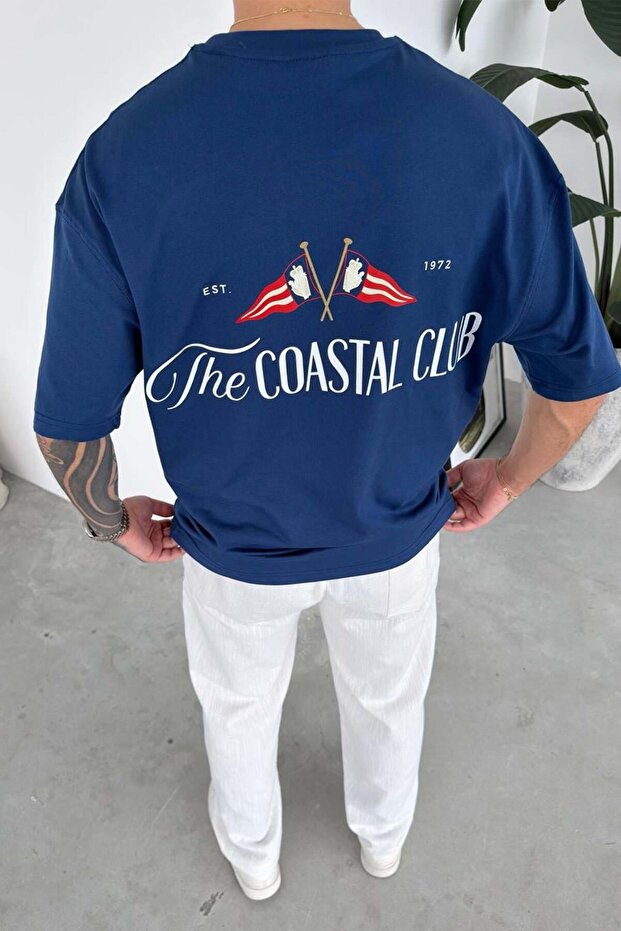 تي شيرت كبير الحجم مطبوع عليه Coastal باللون الأزرق الداكن