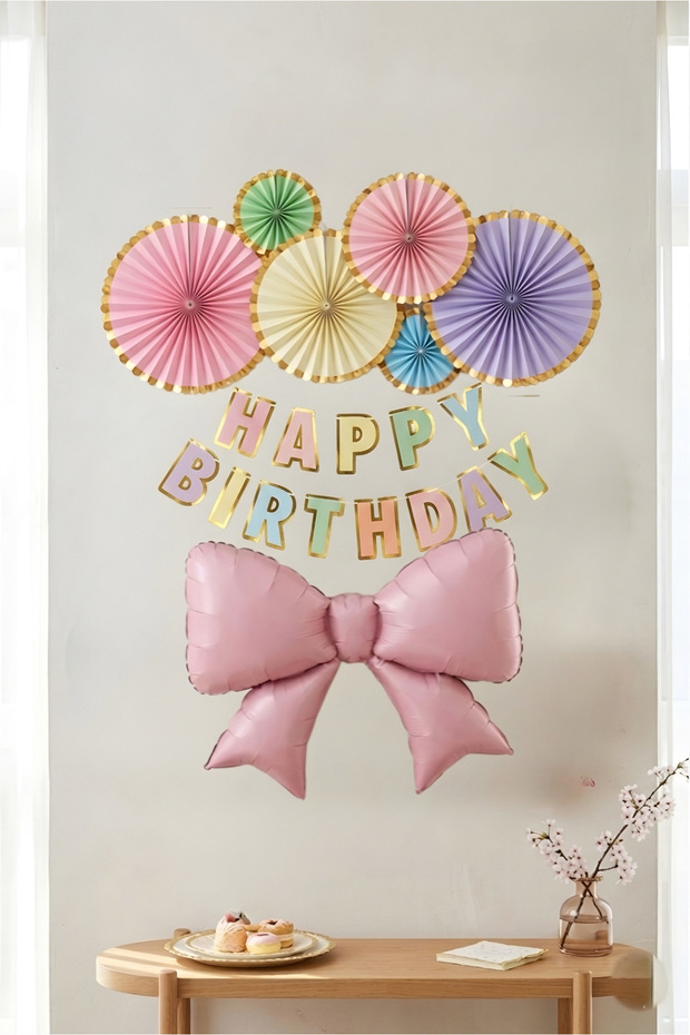 Pastel Colored Happy Birthday Banner - Birthday Concept with Paper Fan and Large Bow Foil Balloon