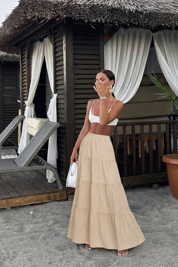 تنورة نسائية طويلة واسعة من الأسفل بلون بيج مريح وعصري