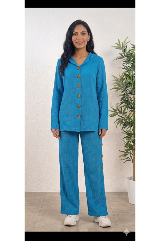 Muslin cotton fold-over sleeve, wide-leg, buttoned sides, hooded shirt and pants set.