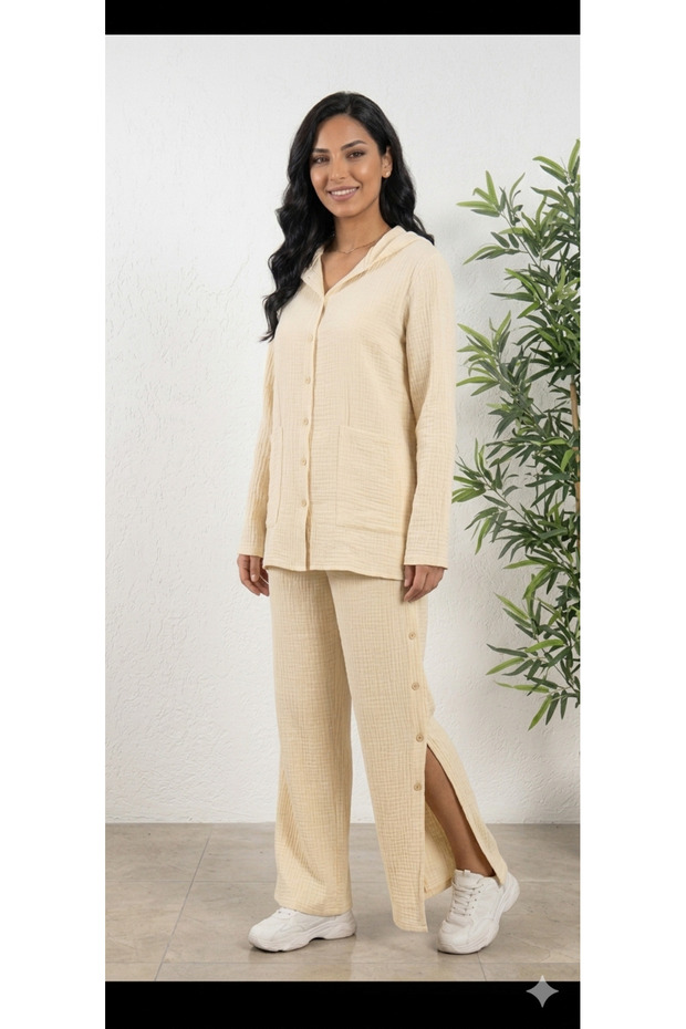 Muslin cotton fold-over sleeve, wide-leg, buttoned sides, hooded shirt and pants set.