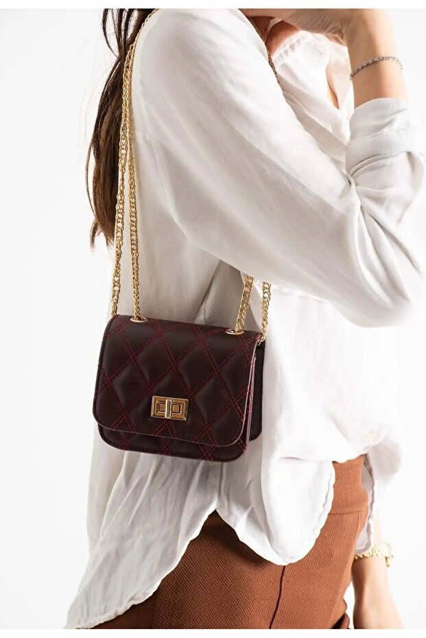 Woman's elegant mini burgundy hand and shoulder bag