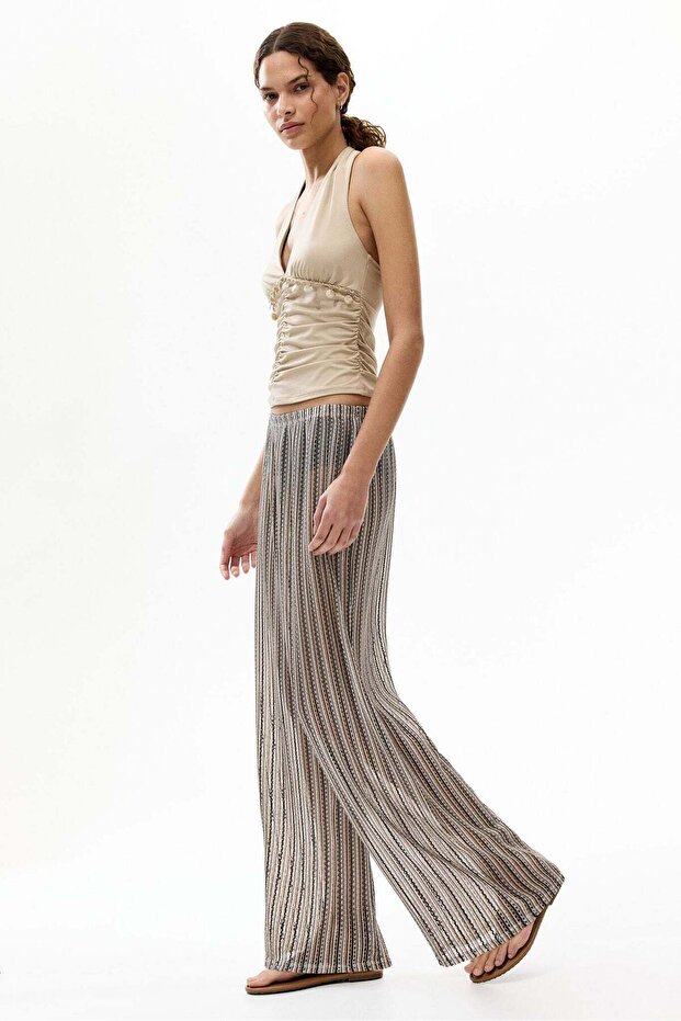 Wide hole-knit trousers