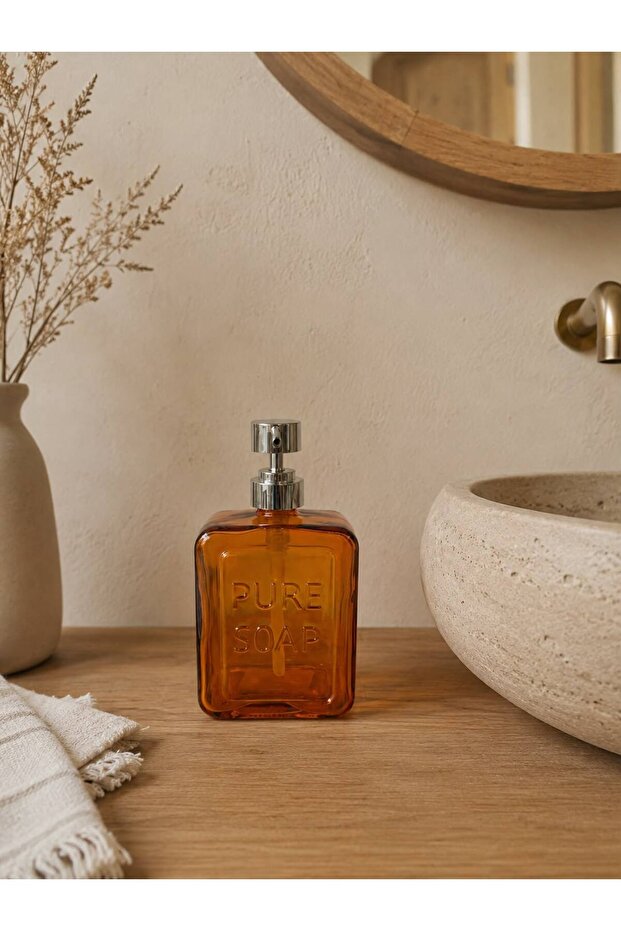 Glass Liquid Soap Dispenser with the Words "Pure Soap" Written on It.