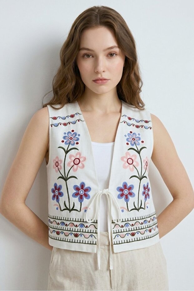 White V-Neck Vest with String Tie Detail and Multi-Color Embroidery