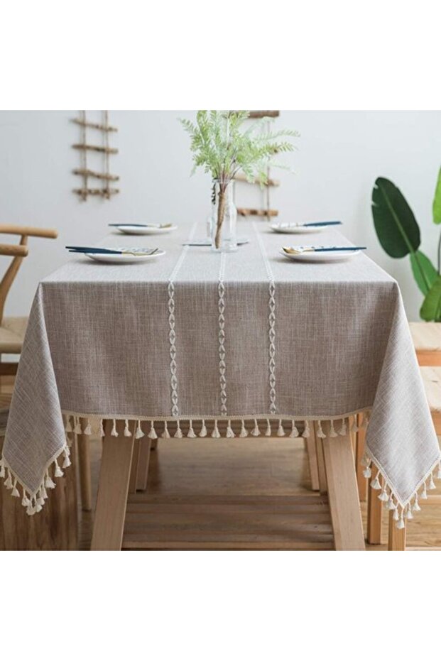 features tassels, is a cotton-linen blend, is elegant and sophisticated, and is washable, making it dining tables