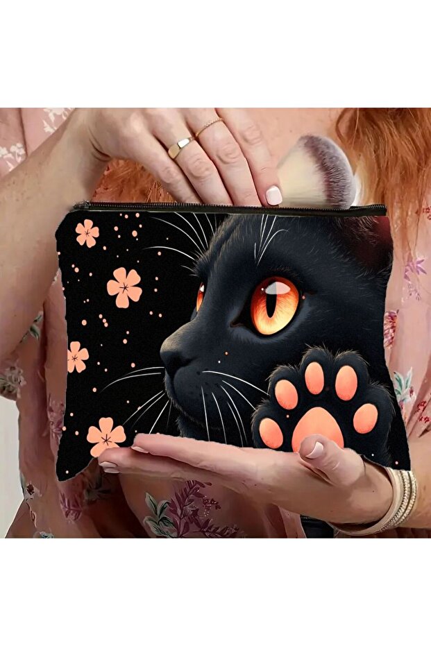 A 1 Piece Black Cat Print Makeup Bag, Decorated with Eye-Catching Orange Eyes and Cute Paw Patterns.