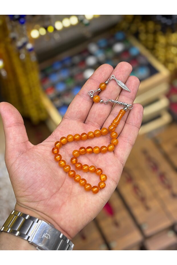 سبحة من حجر العنبر المسحوق بلون برتقالي فاتح بطول الكاحل
