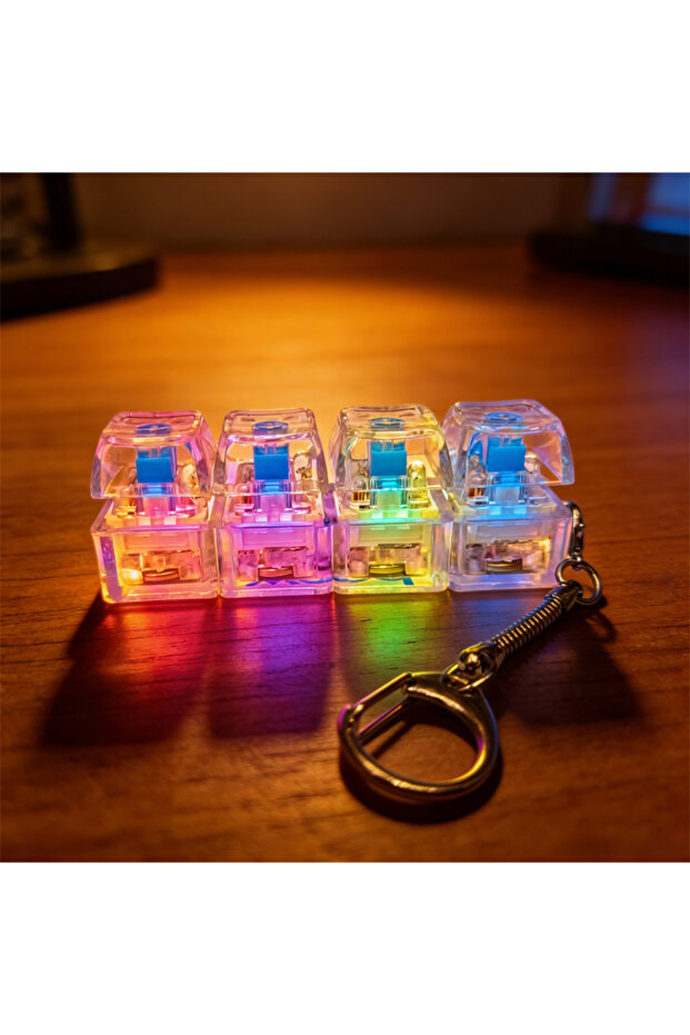 قطعتان من سلسلة مفاتيح بإضاءة LED بيضاء، لعبة فيدجيت بزر قابل للضغط على شكل لوحة مفاتيح لتخفيف التوتر والقلق
