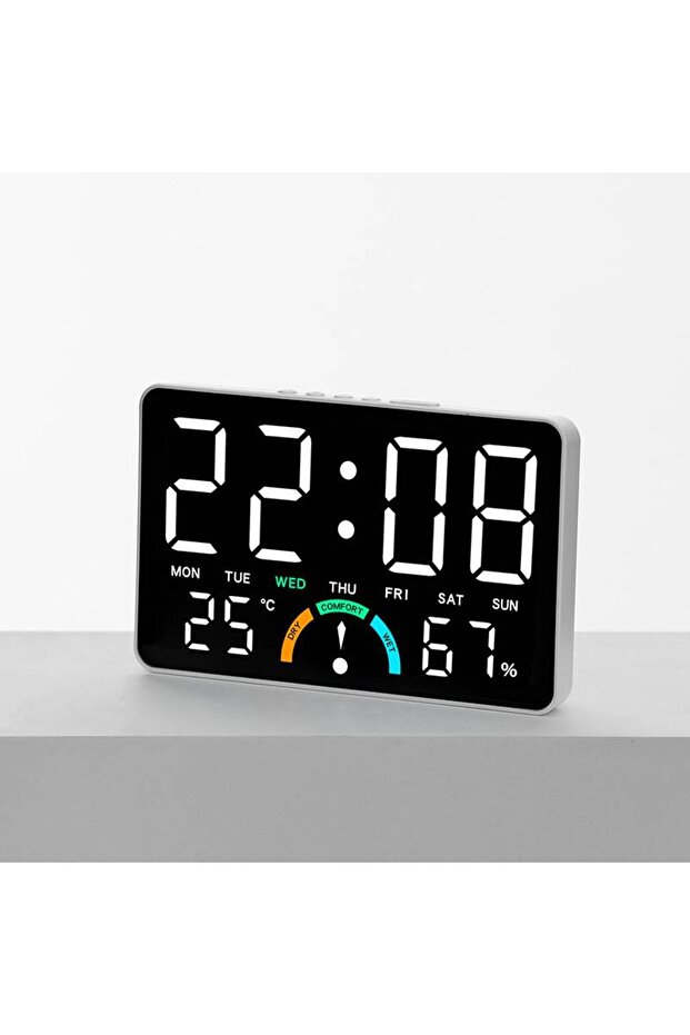 This multi-functional LED clock features a large display screen and can be wall-mounted or placed on a table. It displays the time, day of the week