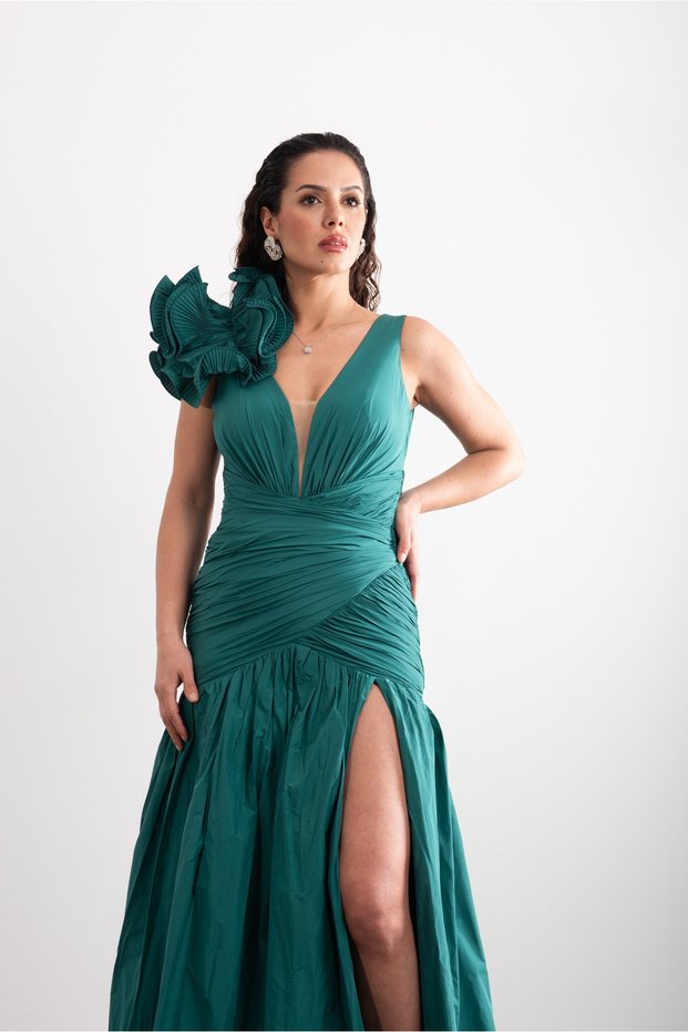 Stylish Evening Gown with V-Neck, Draped Back, Front Slit, and Shoulder Pleat Accessory Detail.