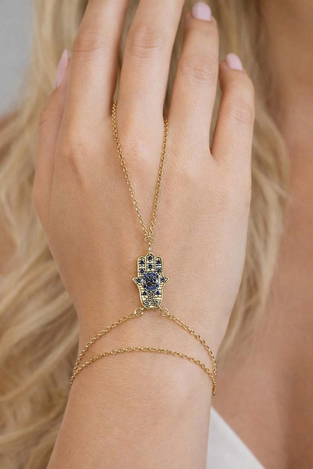 Gold steel shahmeran with stone embroidered hamsa