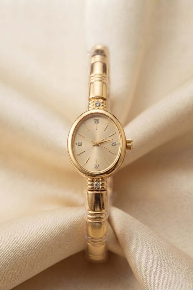 Mei̇ra Women's Gold Steel Handcuff Wristwatch with Champagne Dial and Stone Detail Luxury Elegant Bracelet Watch 2026