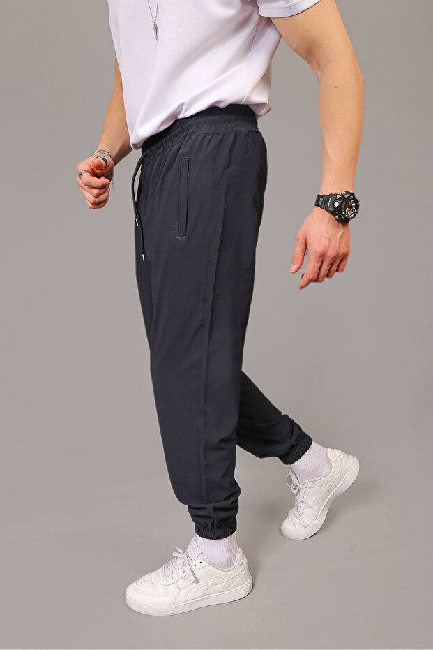 Men's Baggy Style Parachute Fabric Sweatpants with Zippered Pockets and Elastic Cuffs
