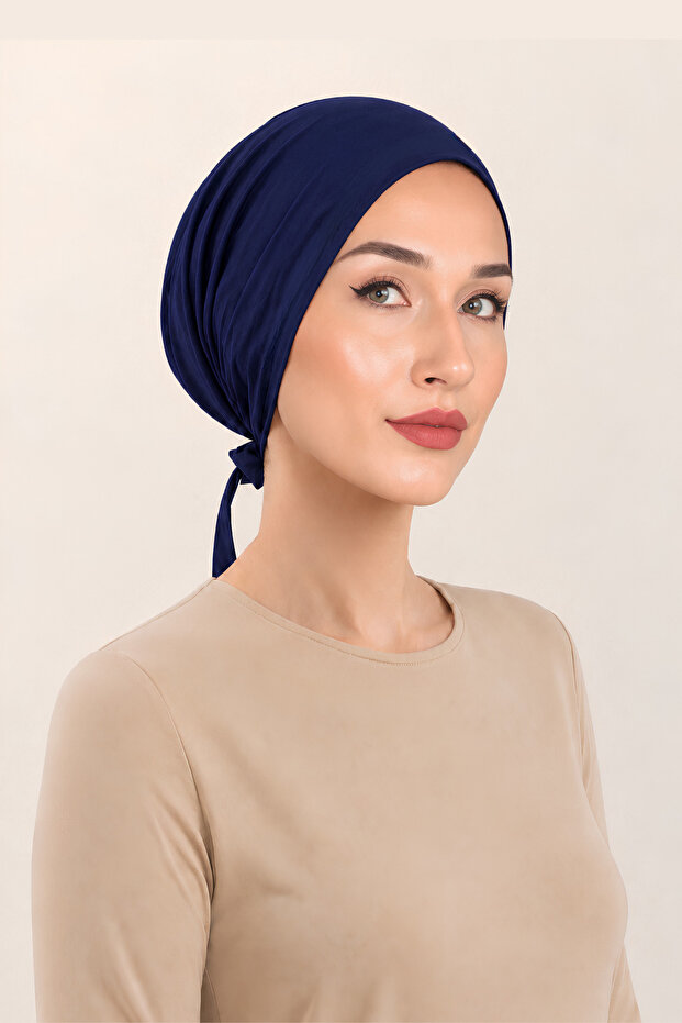 قبعة داخلية من السيليكون غير قابلة للانزلاق، بدون خياطة من الأمام، باللون الأزرق الداكن، لا تترك أثراً، مرنة ومريحة.