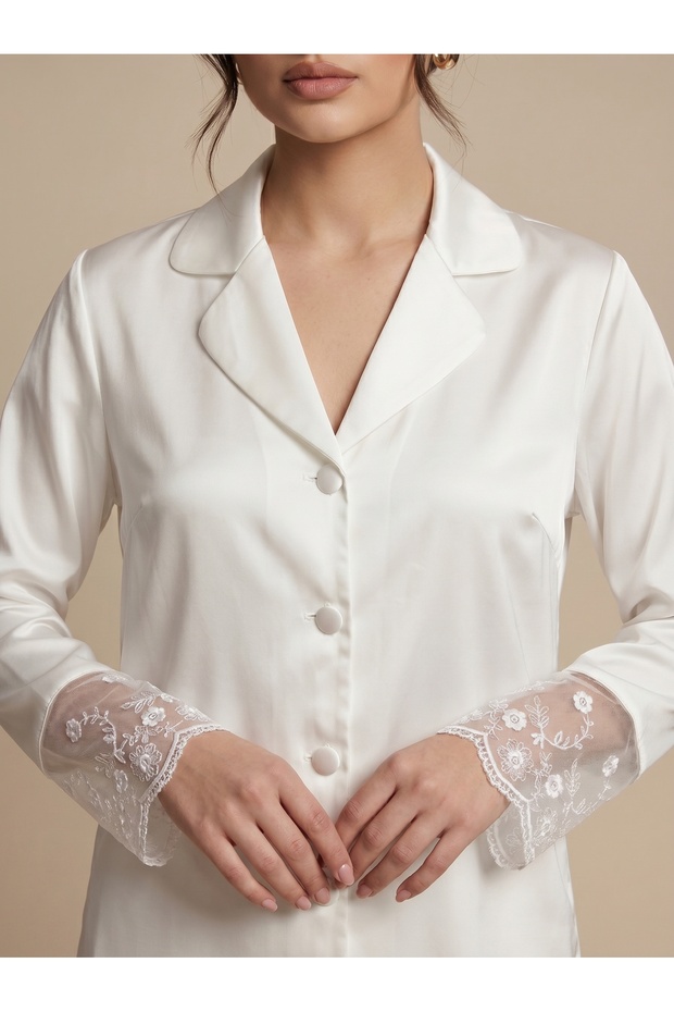 White Satin, Long-Sleeved Pajama Set with Lace Detailing on the Cuffs.