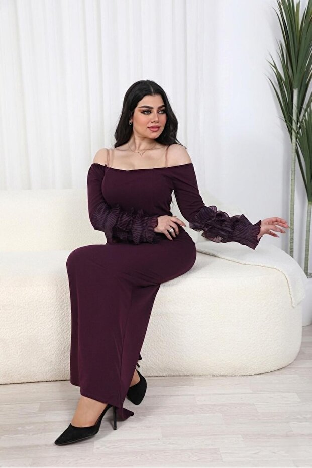فستان راقٍ بتصميم عصري يجمع بين الأناقة والاحتشام