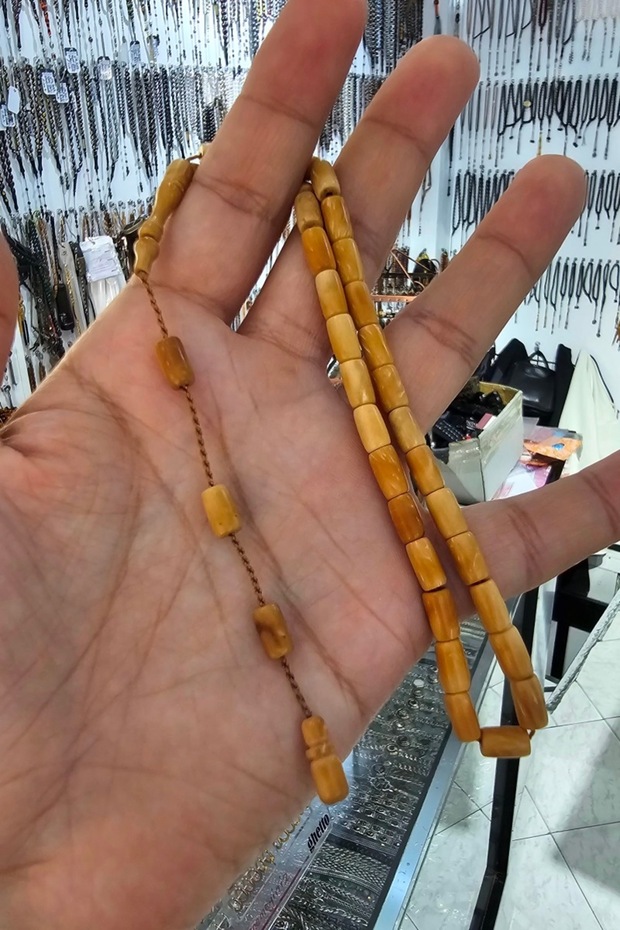 سبحة كوكا الأصلية مقطوعة على شكل كبسولة