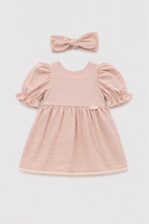 Powder-Colored Baby Dress with Tie-Back and Scalloped Hem.