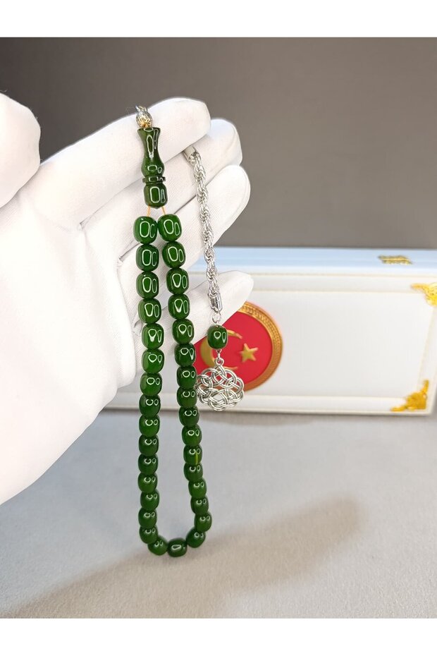 Green spinning amber rosary