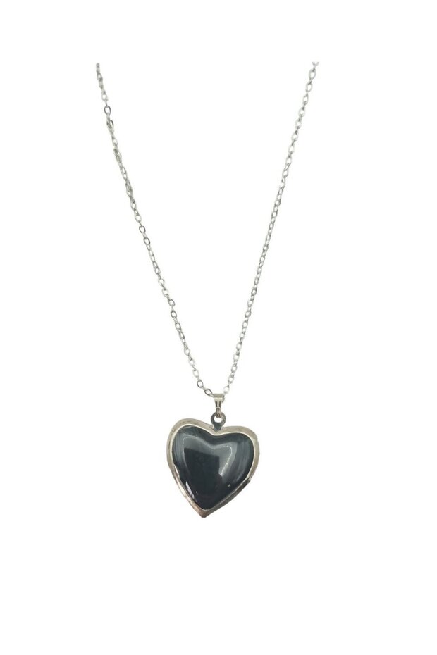 Heart-shaped, black pendant with a lid that opens to hold a picture.