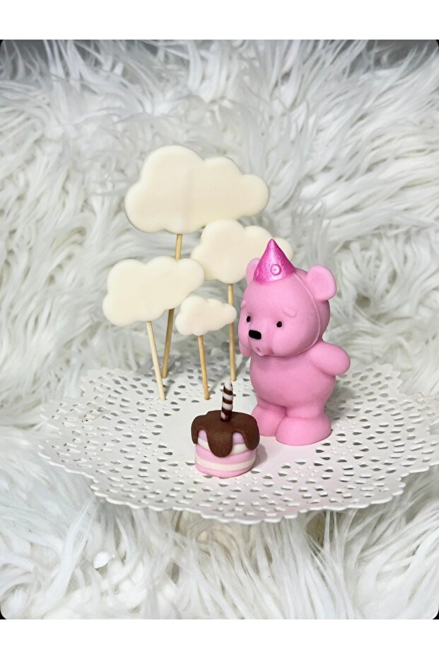 Mum üfleyen, mini ayıcık figürü