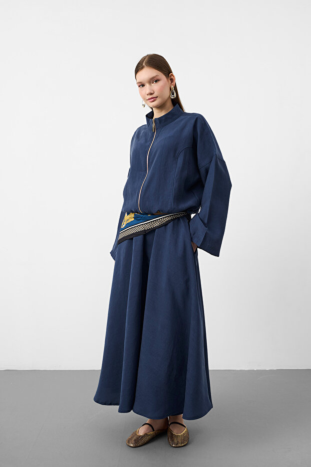 Navy blue women's tencel fabric skirt with belt detail, flowy textured jacket and skirt set.
