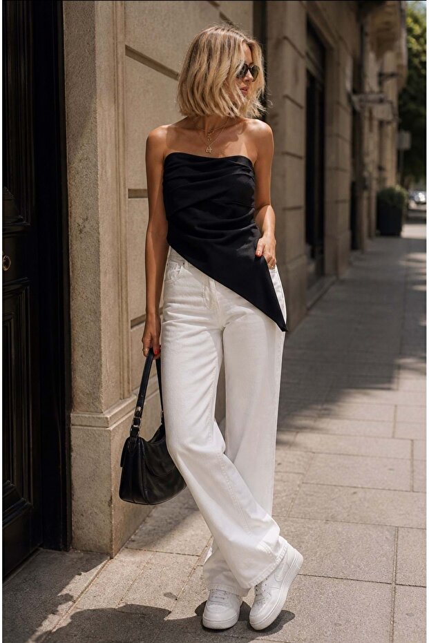 Black asymmetrical cut draped strapless blouse