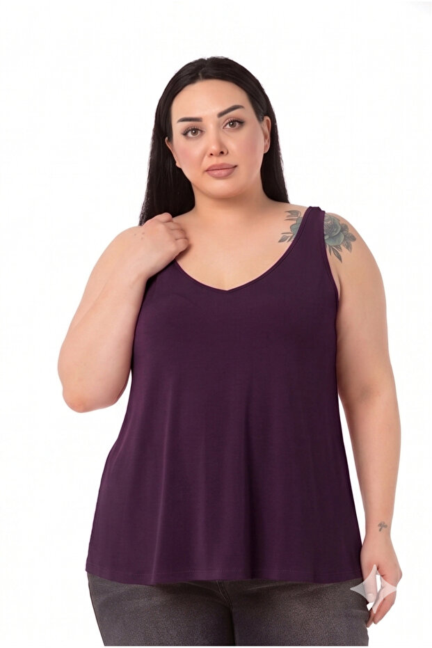 بلوزة كبيرة الحجم بقصة واسعة وياقة على شكل حرف V بلون البرقوق