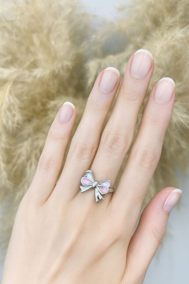 Pink Bow Minimal Ring – a Symbol of Elegance, Innocence, and Feminine Energy