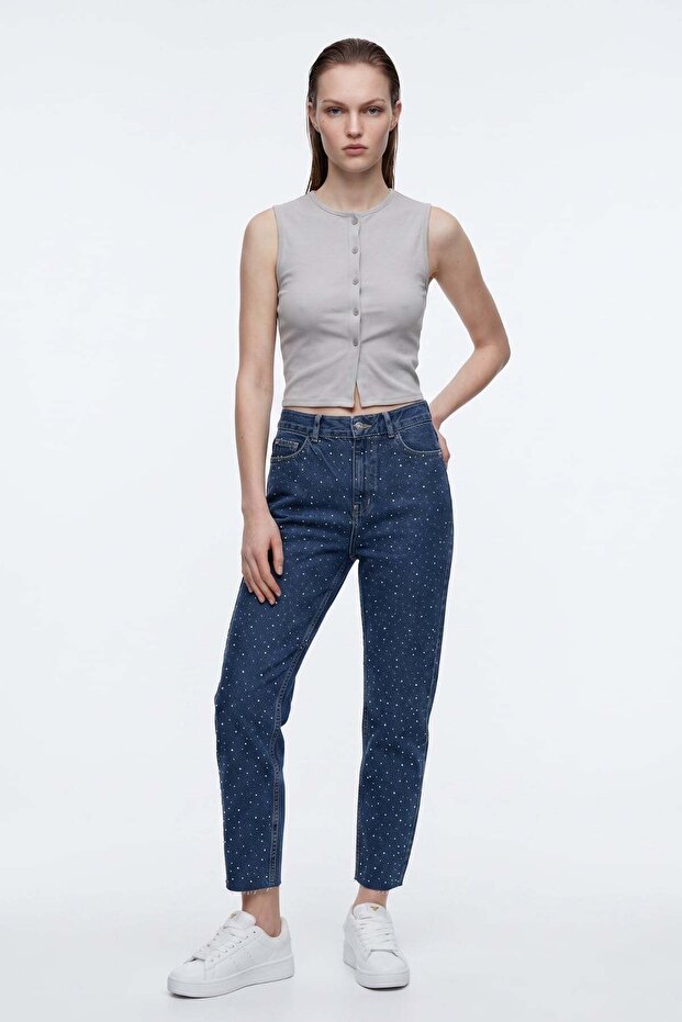بنطلون جينز موم بفتحات أمامية وخلفية وحواف مقطوعة
