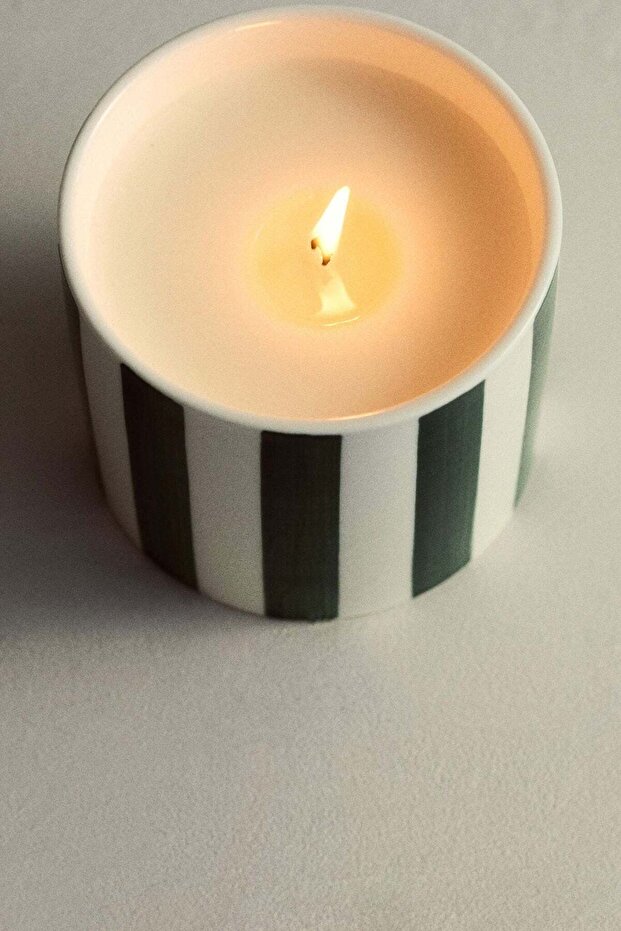Scented candle in ceramic holder