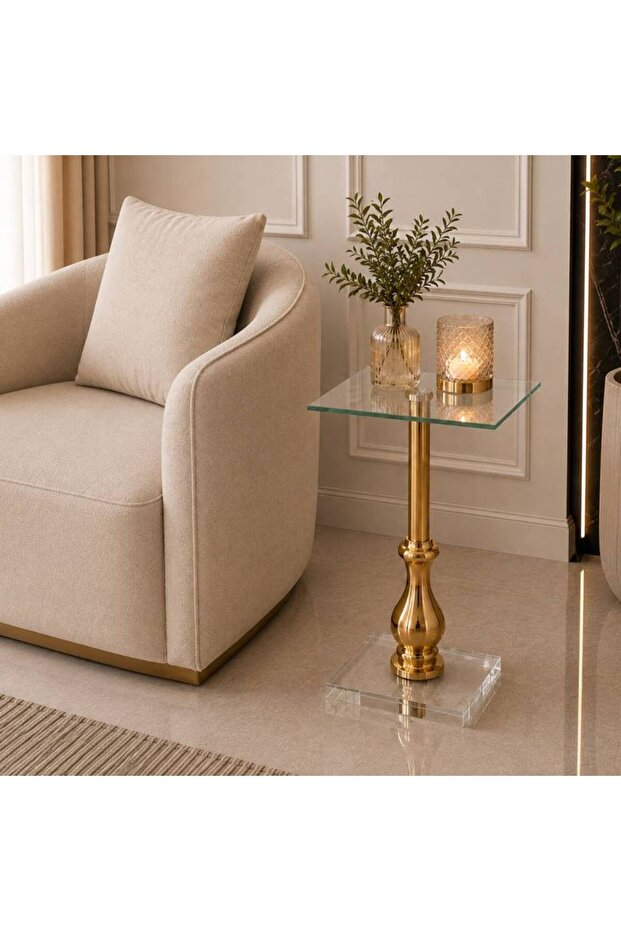 Modern side table with glass top and transparent golden base