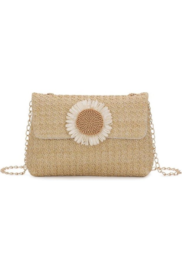 Women's straw clutch - a summer beach bag with rattan details.