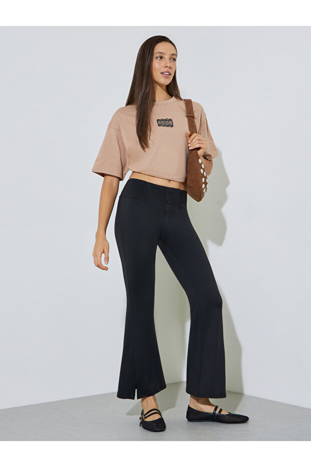 Black Solid Flared Pants with Button Detail