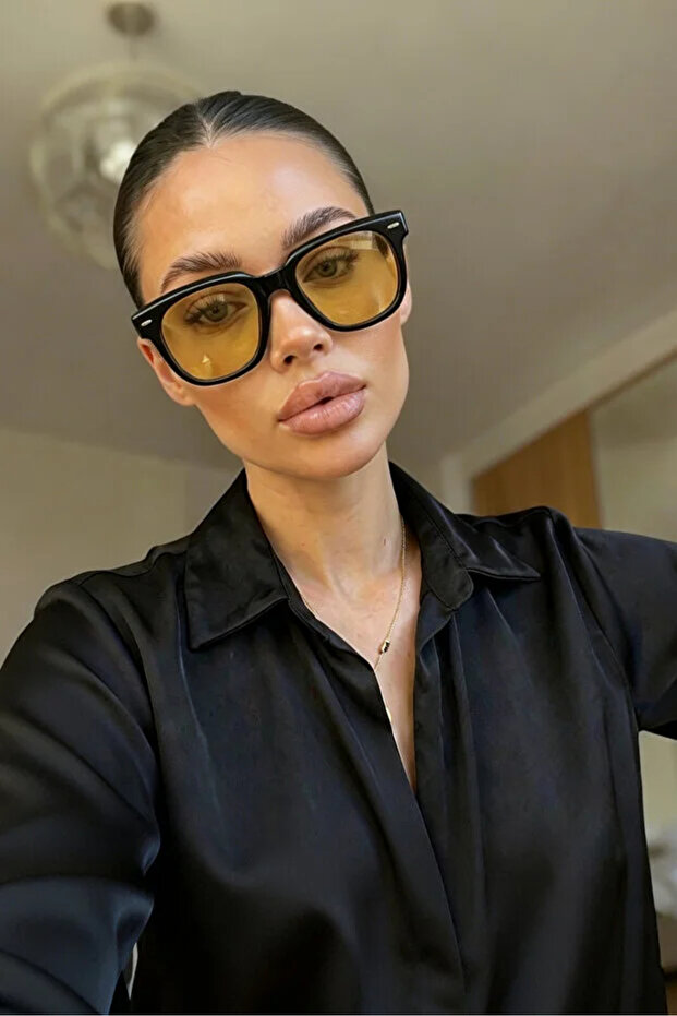 نظارات شمسية بيضاوية الشكل باللون الأسود والبرتقالي للجنسين