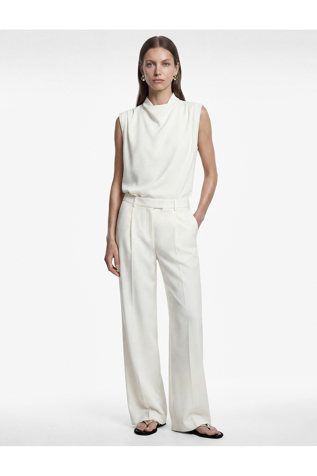 High Collar Sleeveless Blouse with Drape Detail