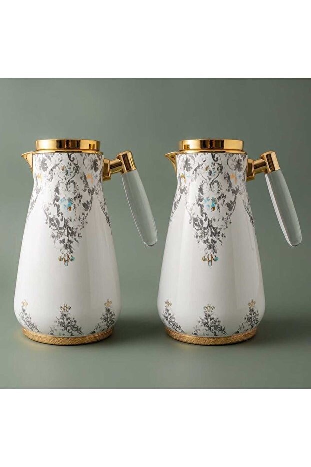 A White Magic Thermos Set With A Transparent Gold Handle, Two Pieces