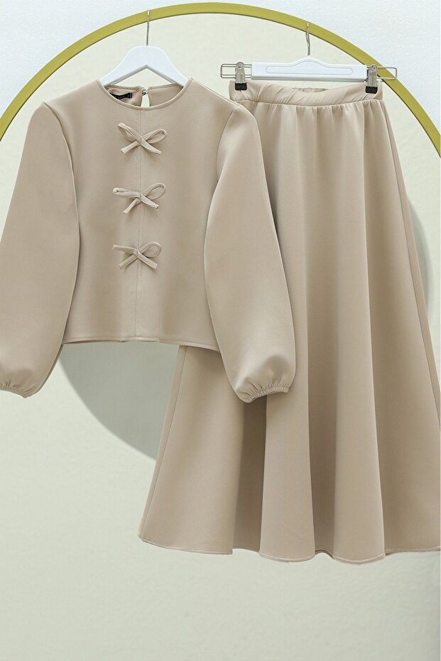 Scuba suit with bow detail skirt - beige