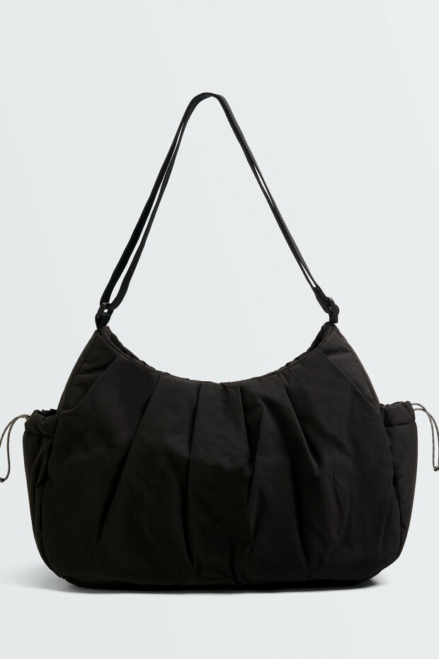Shopper bag with side pockets