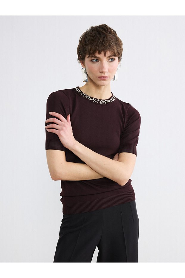 Alita city: stand out with our oval neck, stone embellished women's knit sweater.